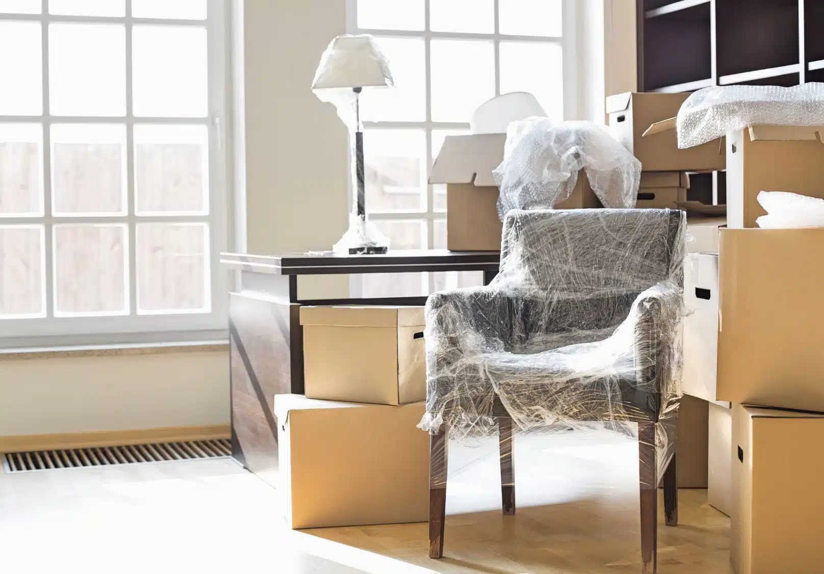 Packed living room with boxes and furniture ready for a move