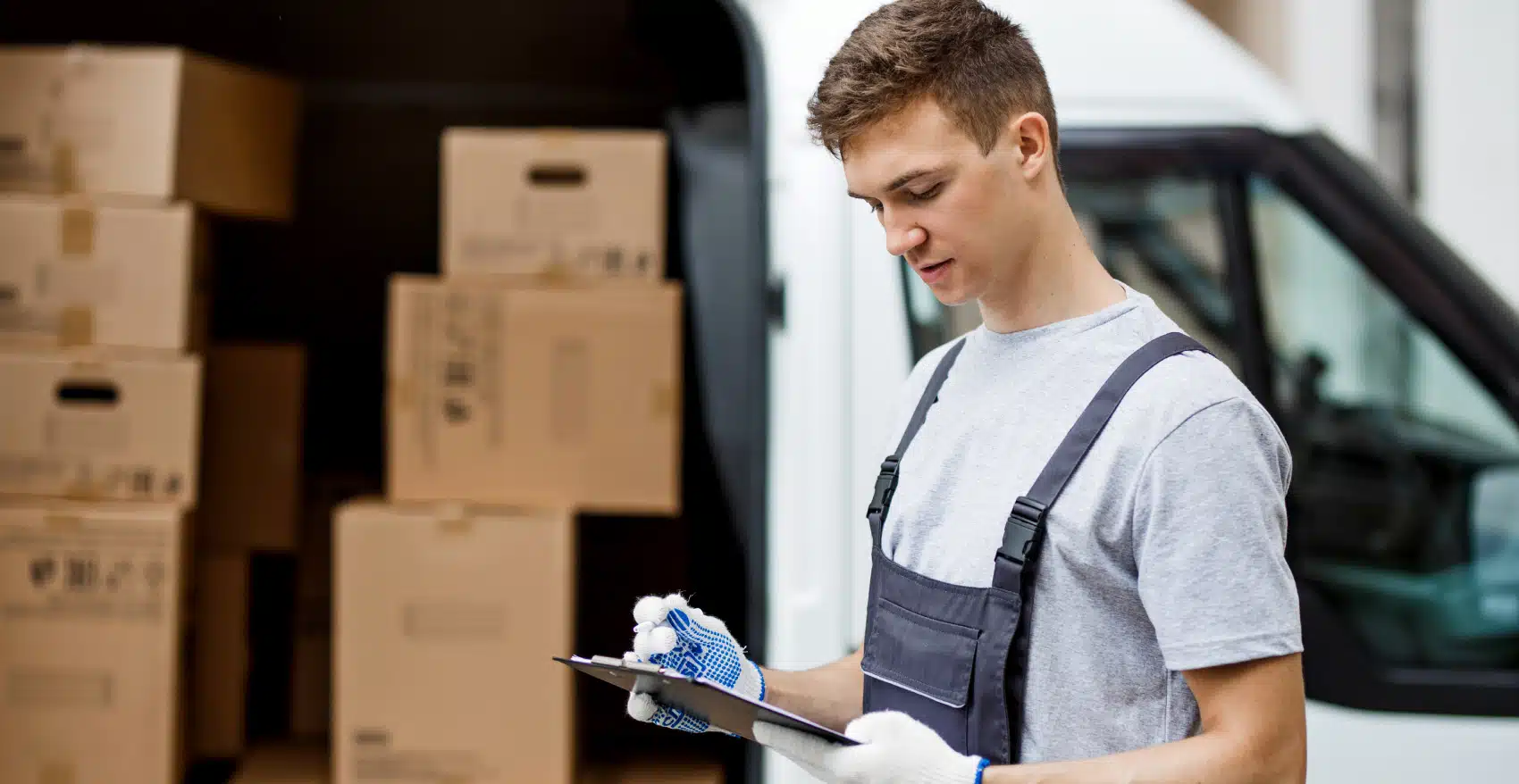 Professional Mover checking inventory list during a local move in Buckeye, AZ